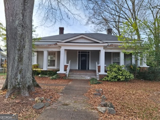 greek revival inspired property with covered porch