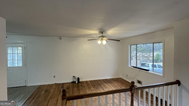 unfurnished room featuring hardwood / wood-style floors and ceiling fan