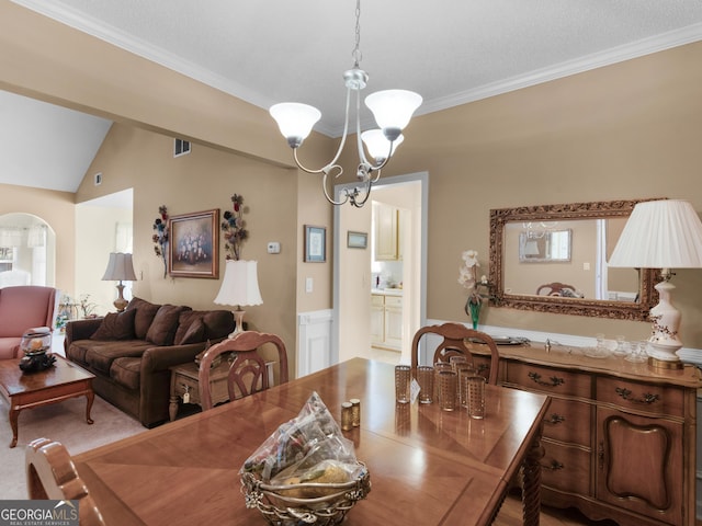 509 Carleton Pl, Locust Grove, GA 30248 - dining room with ornamental molding, a chandelier, and arched walkways
