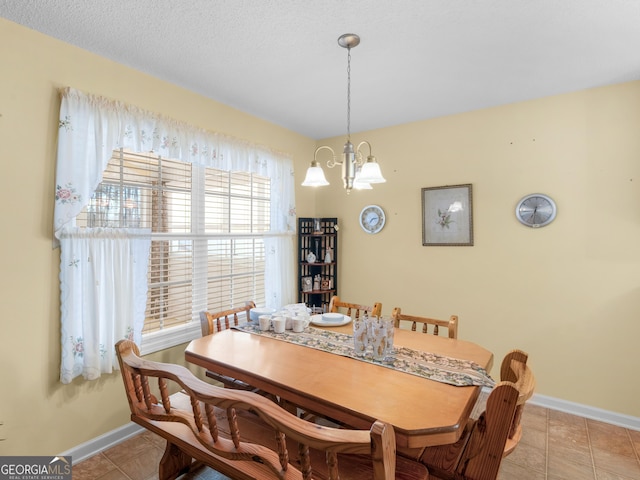 509 Carleton Pl, Locust Grove, GA 30248 - dining space with a chandelier, baseboards, and light tile patterned floors