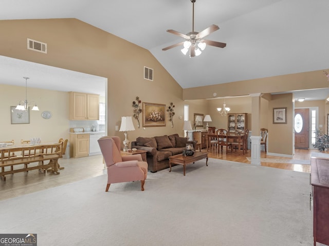 509 Carleton Pl, Locust Grove, GA 30248 - living area featuring a chandelier, high vaulted ceiling, a ceiling fan, and light colored carpet