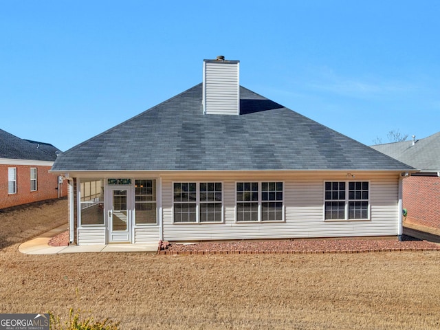 509 Carleton Pl, Locust Grove, GA 30248 - rear view of property featuring roof with shingles and a chimney