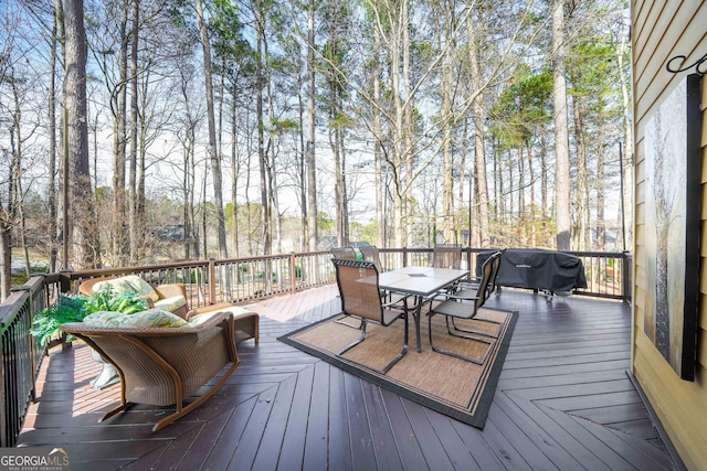 wooden deck with outdoor dining space