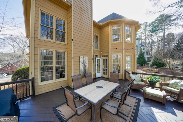 deck with outdoor dining area, area for grilling, and an outdoor living space