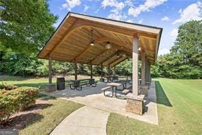 view of property's community featuring a lawn and a gazebo