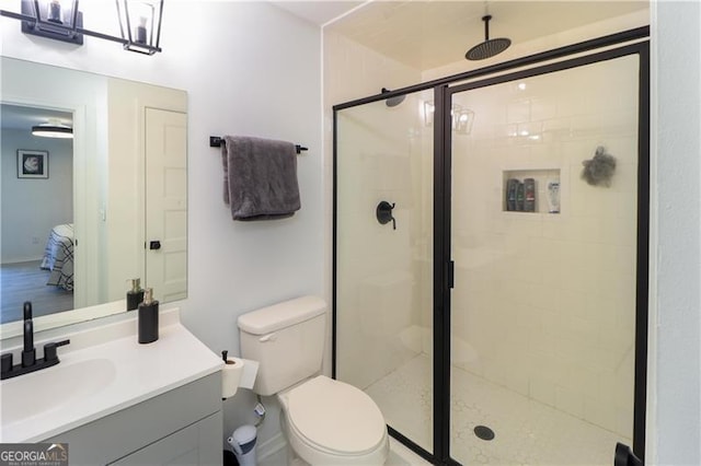 709 Berkeley Woods Unit 709, Duluth, GA 30096 - bathroom featuring a stall shower, vanity, ensuite bath, and a chandelier