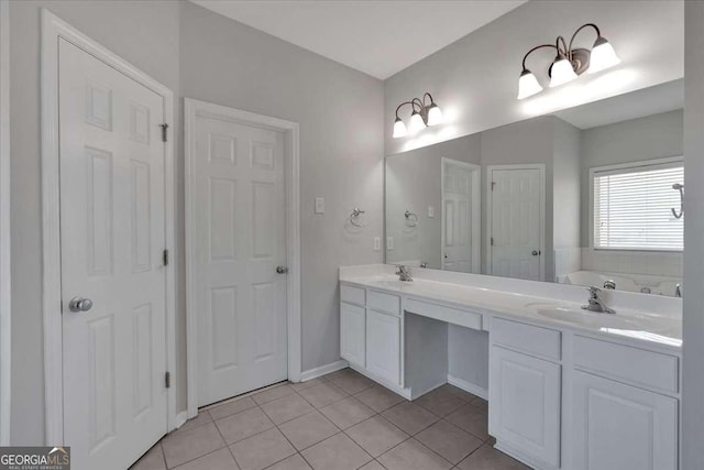 bathroom featuring double vanity, a bath, a sink, and tile patterned floors