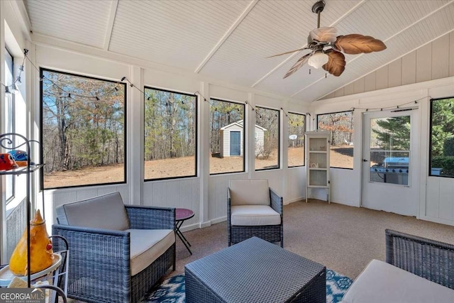 sunroom / solarium featuring vaulted ceiling and a ceiling fan