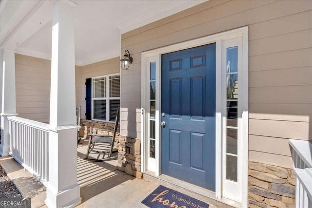 doorway to property featuring stone siding