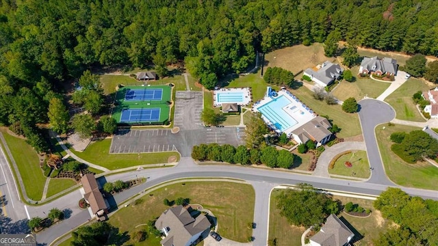 aerial view with a wooded view