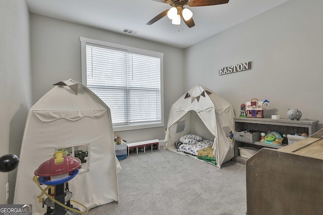 game room with ceiling fan and carpet flooring