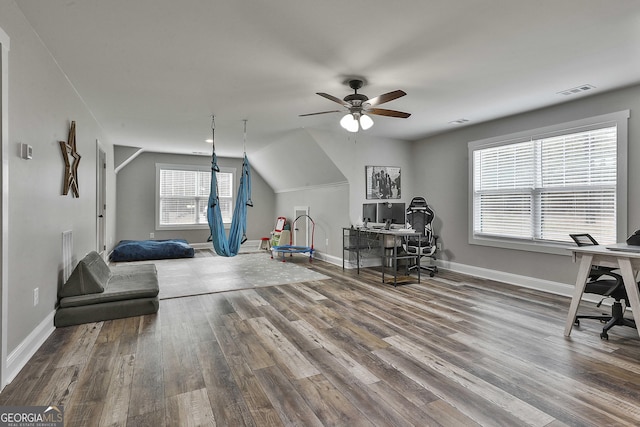 interior space with ceiling fan and wood-type flooring