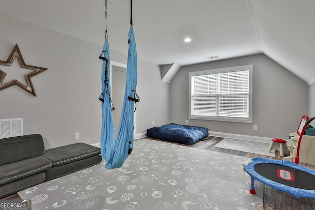 workout area featuring vaulted ceiling