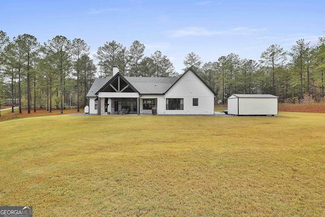 rear view of property with a yard