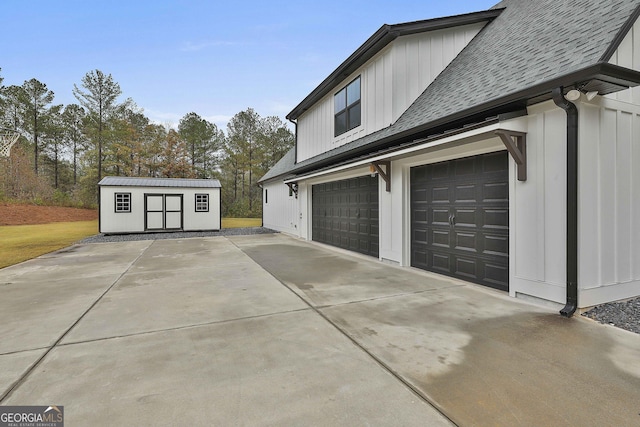 view of property exterior with a garage and a shed