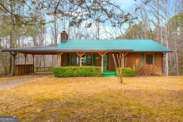 view of front of house with covered porch and a front yard