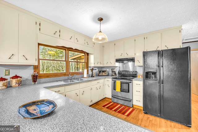 kitchen featuring stainless steel range with electric cooktop, hanging light fixtures, light hardwood / wood-style flooring, sink, and black refrigerator with ice dispenser