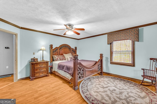 bedroom featuring hardwood / wood-style floors, ceiling fan, crown molding, and a textured ceiling