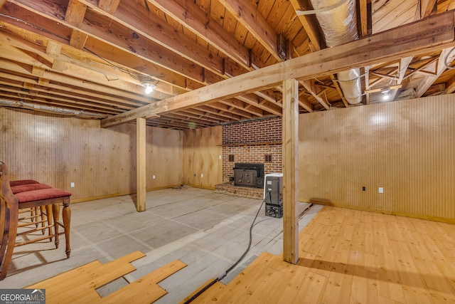 basement with hardwood / wood-style floors