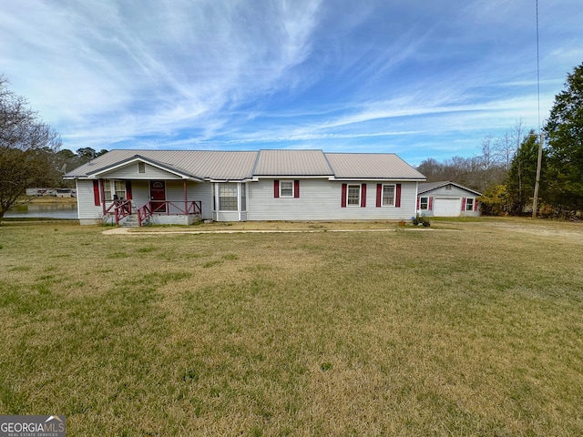 ranch-style home with covered porch, a front lawn, and a garage