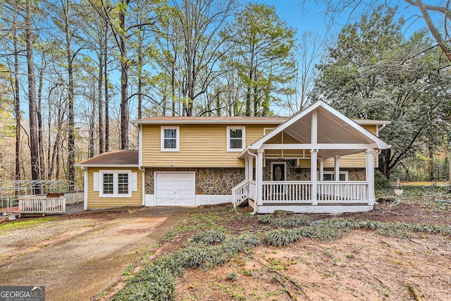 view of front of home with a garage and covered porch