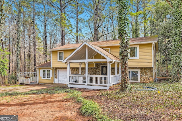 view of front of property with a garage and a porch