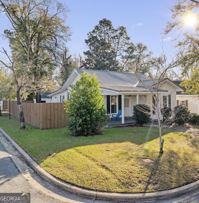 ranch-style home with a front lawn