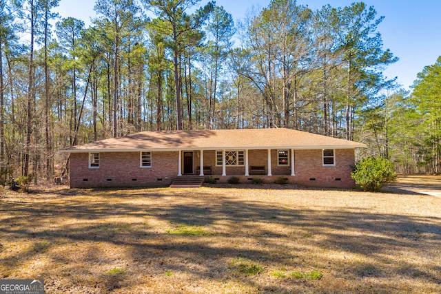 ranch-style home with crawl space, a front lawn, and brick siding