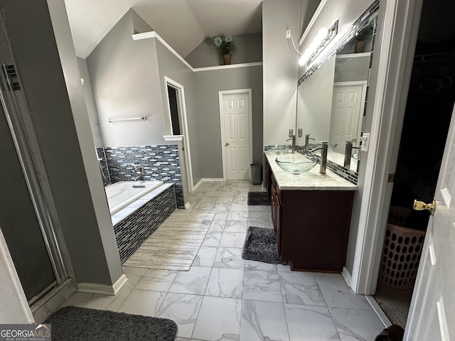 bathroom with tiled bath and vanity