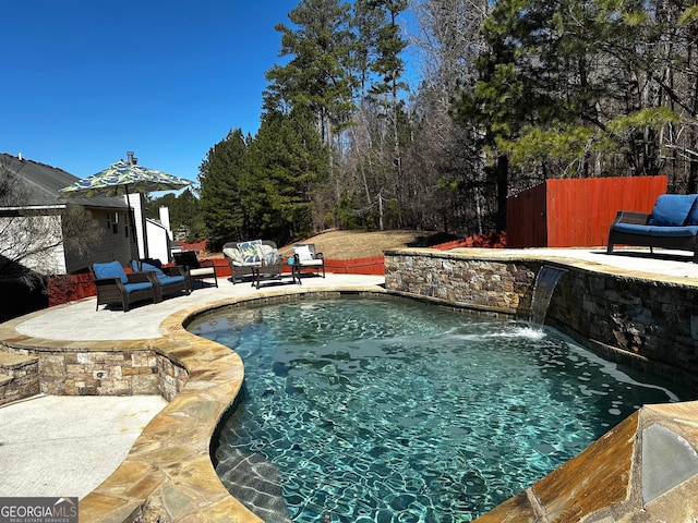 view of swimming pool featuring a patio, an outdoor living space, and pool water feature