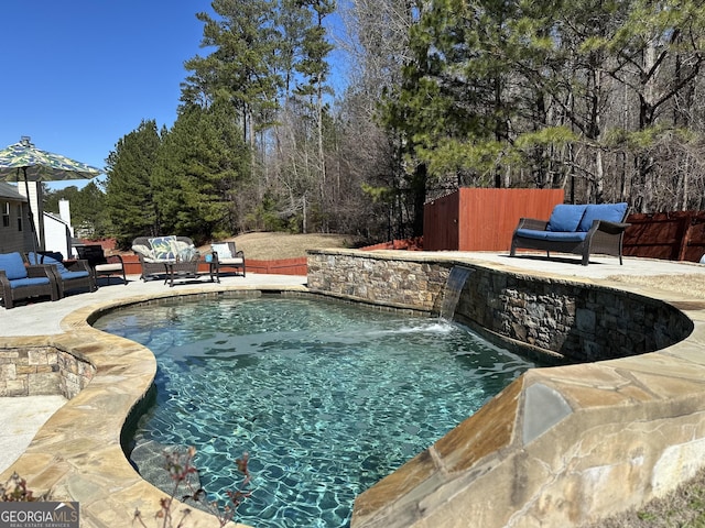 view of swimming pool featuring an outdoor hangout area, a patio, and pool water feature