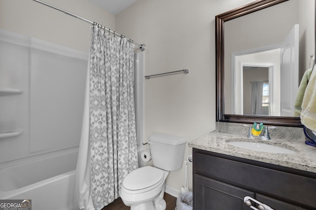 full bathroom with vanity, shower / tub combo, and toilet