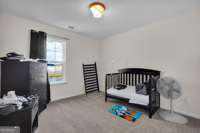 bedroom featuring light colored carpet