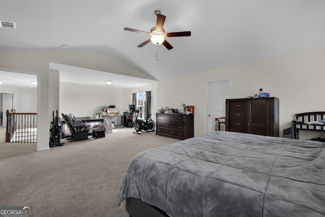 bedroom with ceiling fan, light colored carpet, and lofted ceiling