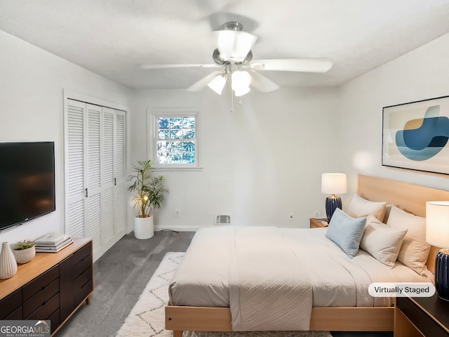 bedroom featuring ceiling fan and a closet