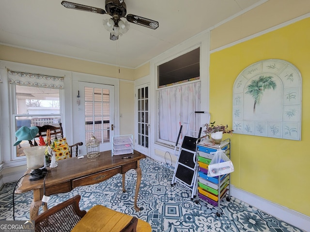 office area with ceiling fan and crown molding