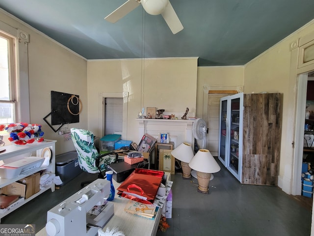 interior space with ceiling fan and crown molding