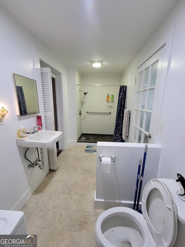 bathroom featuring toilet and walk in shower