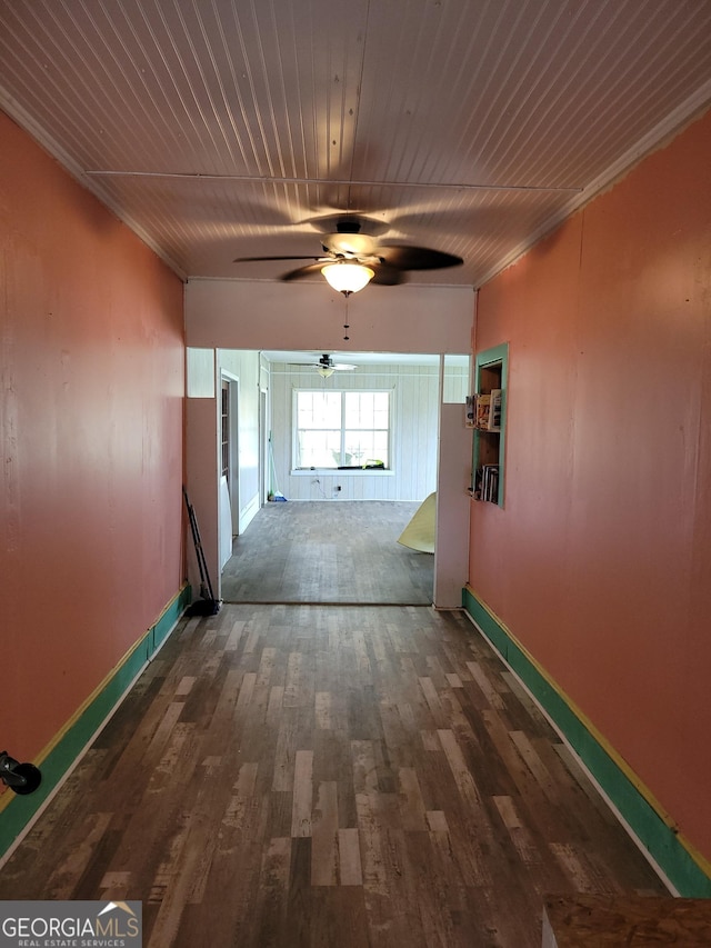 hallway featuring dark hardwood / wood-style floors and wood ceiling