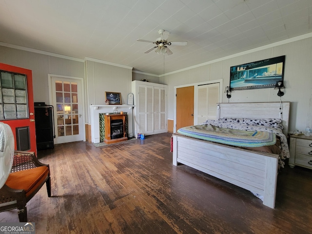 bedroom with ceiling fan, ornamental molding, and dark hardwood / wood-style floors