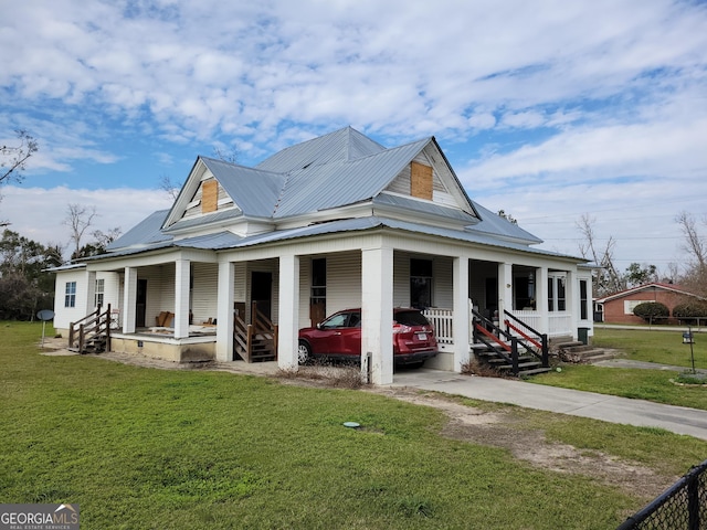 view of front of house featuring covered porch and a front lawn