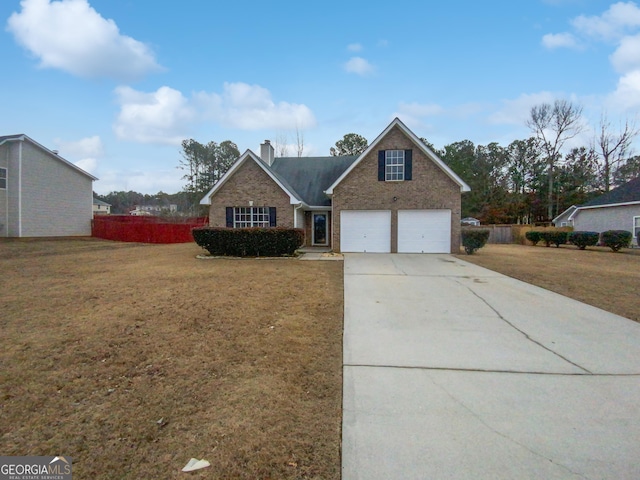 view of front of property featuring driveway, a front lawn, and brick siding