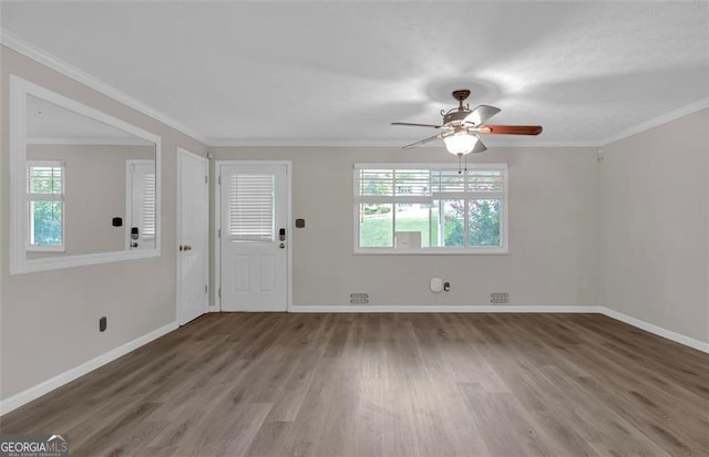 interior space with ceiling fan, crown molding, and hardwood / wood-style floors