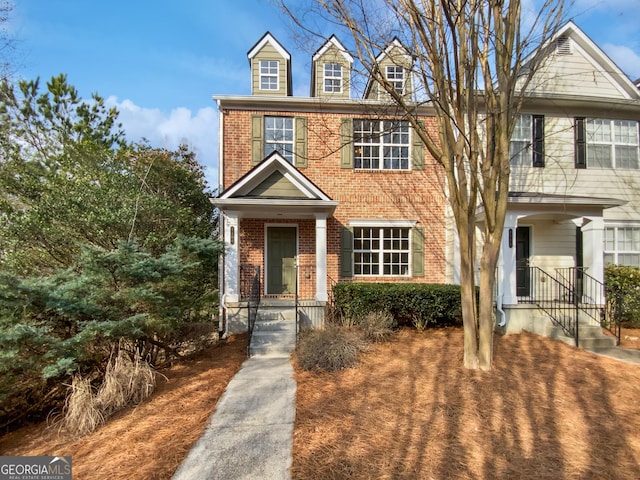 view of front of house featuring brick siding