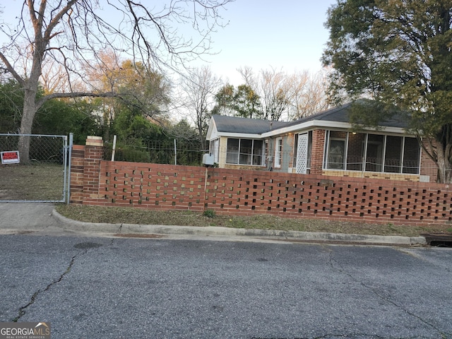 1121 Carroll St, Macon, GA 31206 - view of front of house featuring brick siding