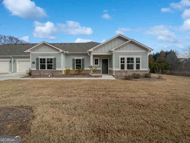 craftsman-style home with a garage and a front lawn