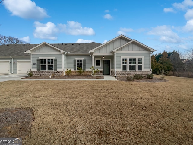 2976 Rambler Dr, Loganville, GA 30052 - view of front facade featuring board and batten siding, a garage, and a front lawn
