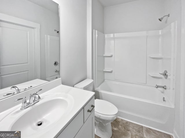 full bathroom with shower / washtub combination, vanity, and toilet