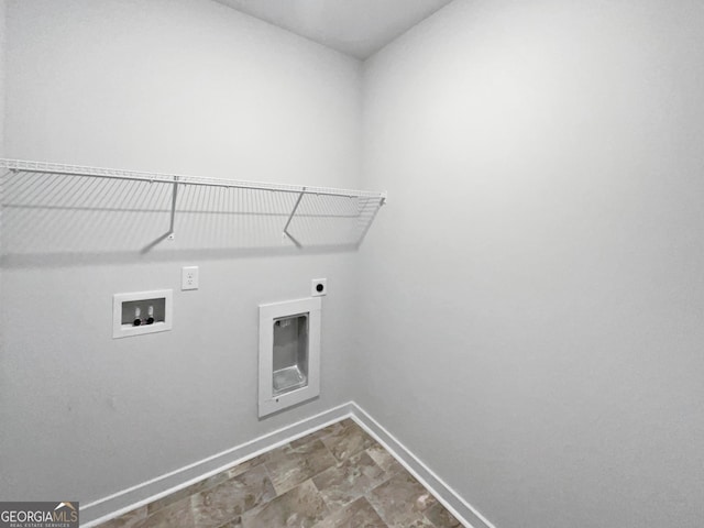 clothes washing area with hookup for a washing machine, laundry area, electric dryer hookup, and baseboards