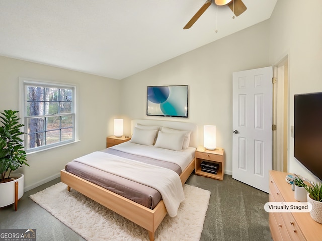 carpeted bedroom featuring vaulted ceiling and ceiling fan